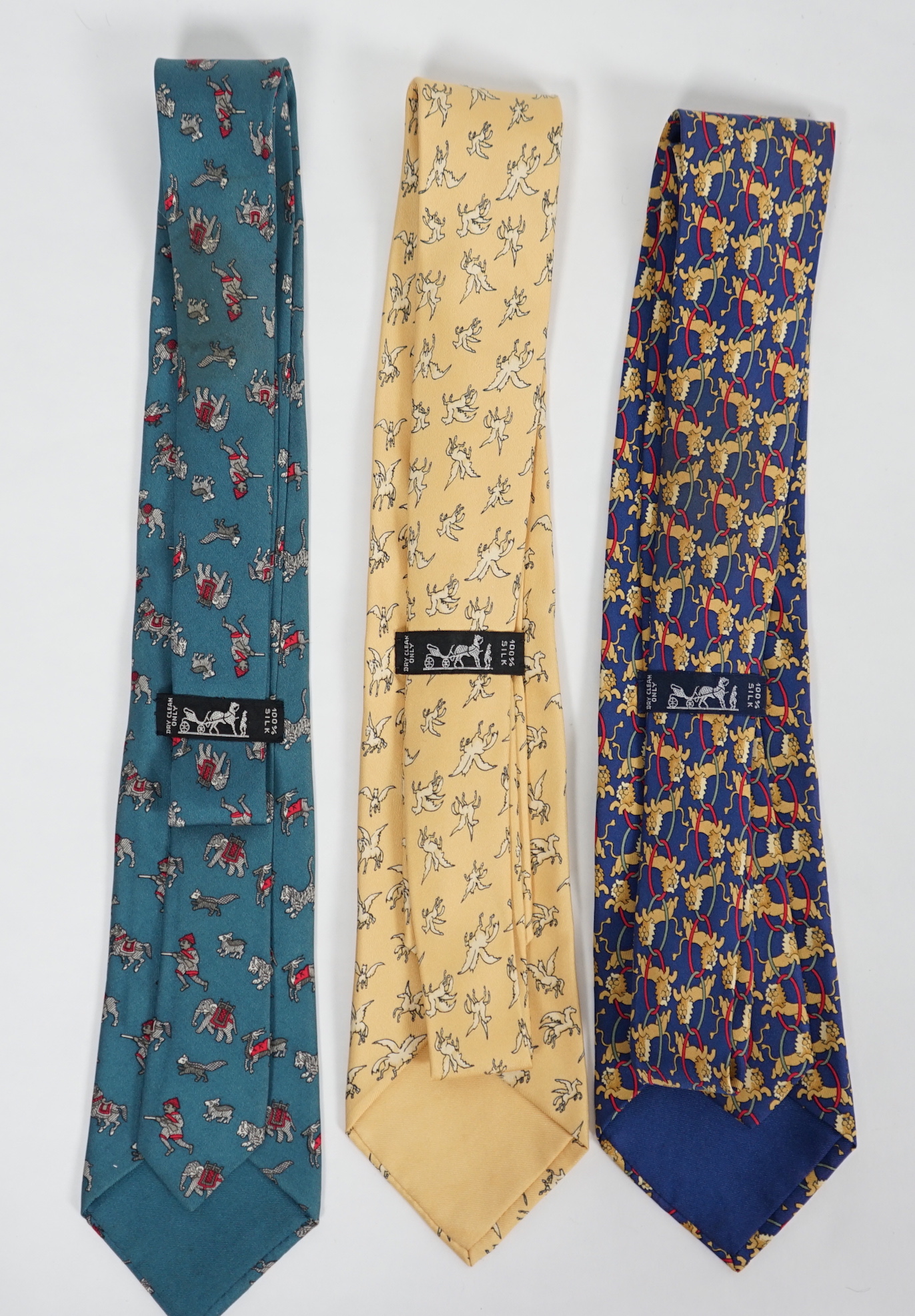 Three Hermès gentlemen's assorted patterned silk ties